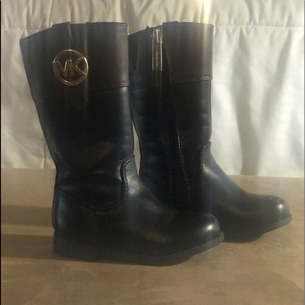 Michael Kors toddler boots with gold hardware.